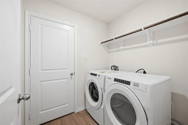 a view of storage and utility room with washer and dryer