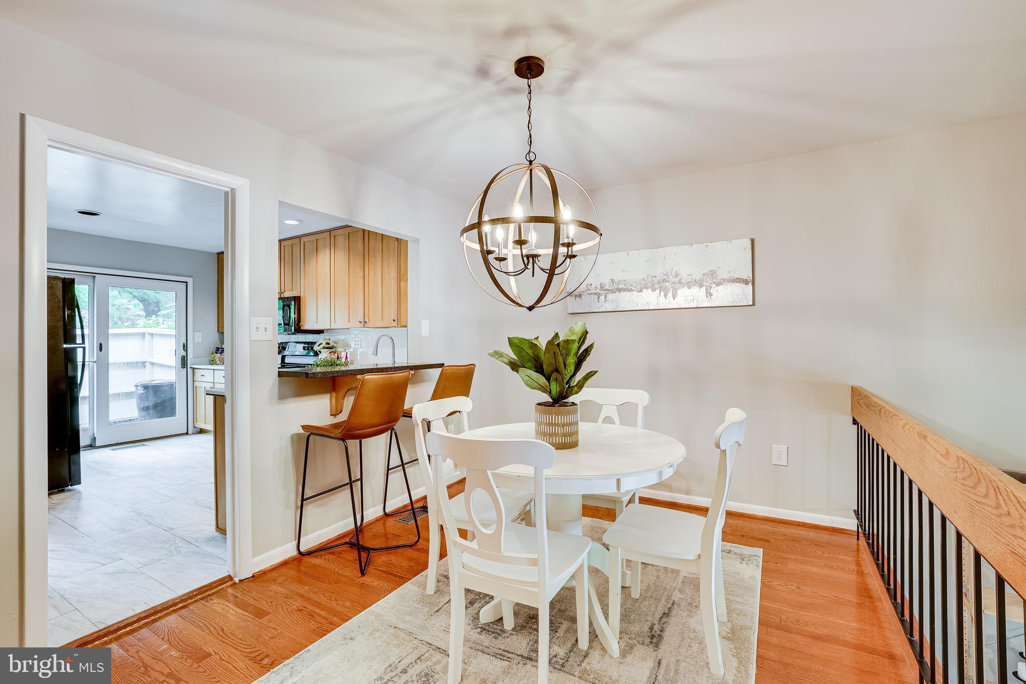 2039 Approach Lane Reston, VA 20191 - Photo 6 of 83 Open Breakfast Bar to Kitchen & Overlook to Living