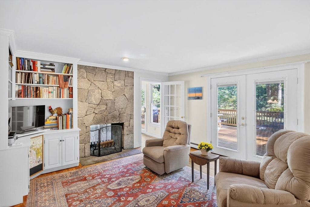 36 Tar Kiln Road Orleans, MA 02653 - Photo 11 of 42 a living room with furniture and a fireplace