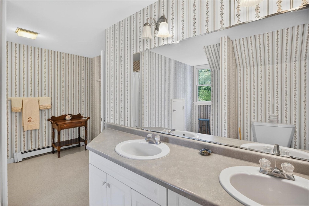 36 Tar Kiln Road Orleans, MA 02653 - Photo 28 of 42 a bathroom with a sink and a mirror