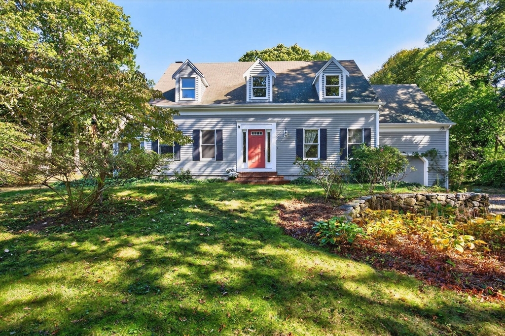 36 Tar Kiln Road Orleans, MA 02653 - Photo 3 of 42 a front view of house with yard and trees around
