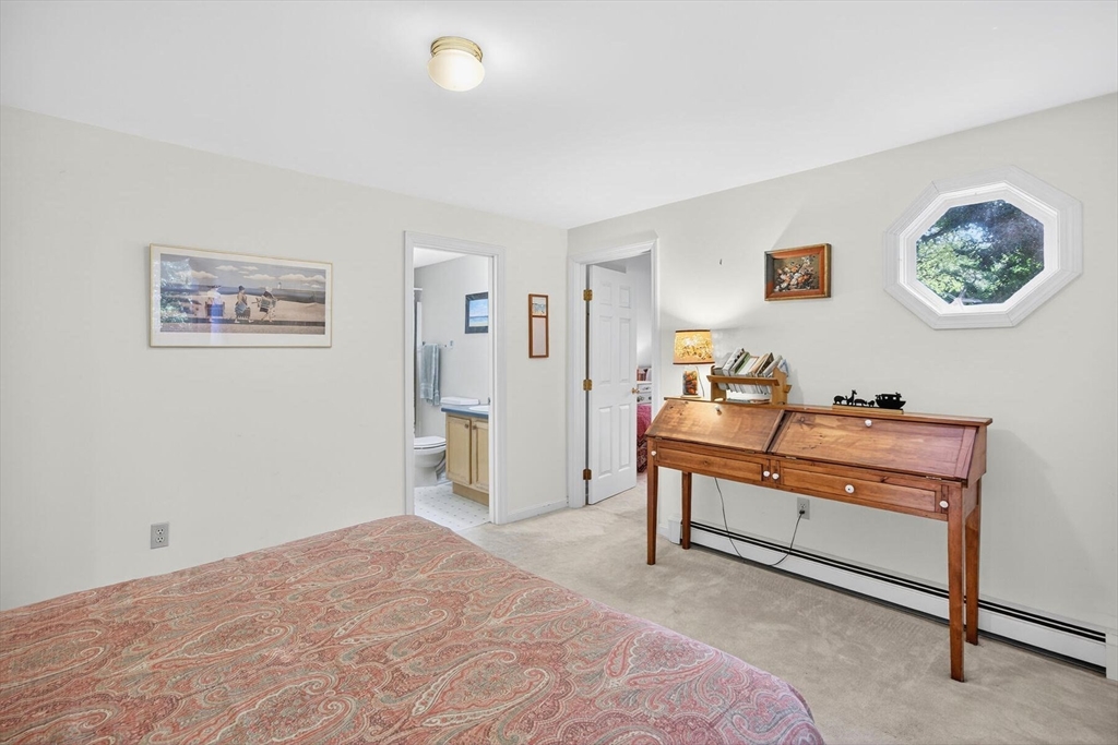 36 Tar Kiln Road Orleans, MA 02653 - Photo 32 of 42 a bedroom with a bed and a workspace
