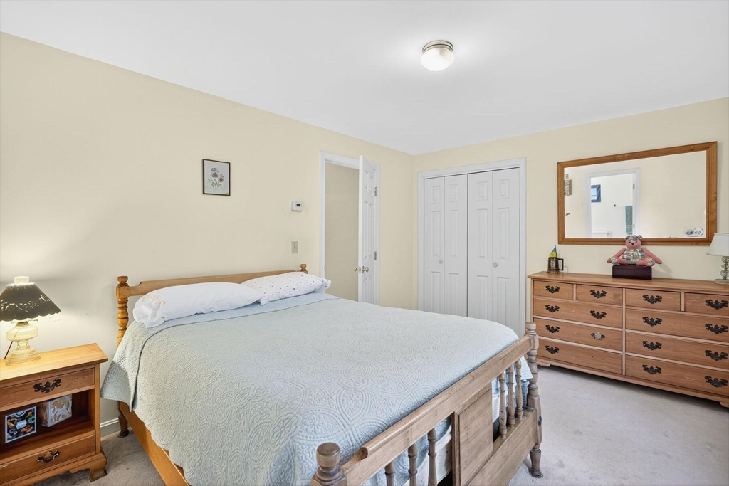 36 Tar Kiln Road Orleans, MA 02653 - Photo 35 of 42 a bedroom with a bed and a dresser