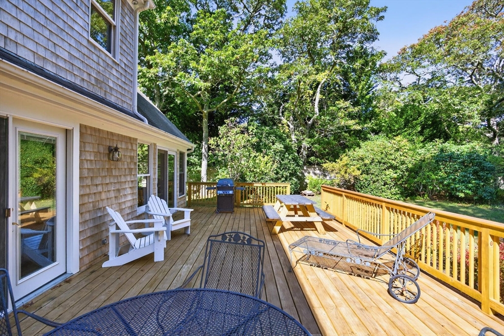 36 Tar Kiln Road Orleans, MA 02653 - Photo 39 of 42 a view of balcony with chairs and wooden fence