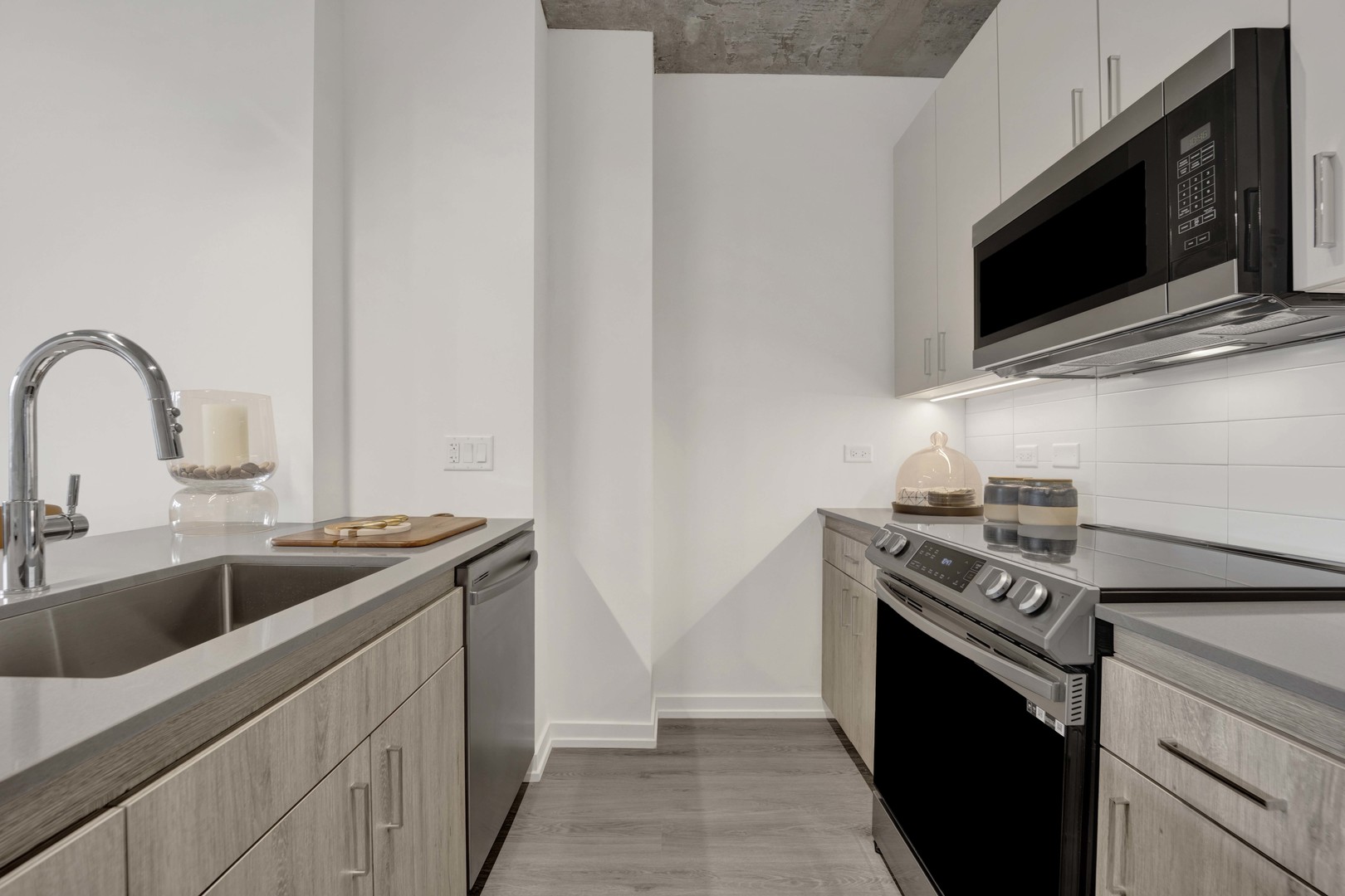 808 North Cleveland Avenue, Unit 810 Chicago, IL 60610 - Photo 10 of 17 a kitchen with stainless steel appliances granite countertop a sink and a stove