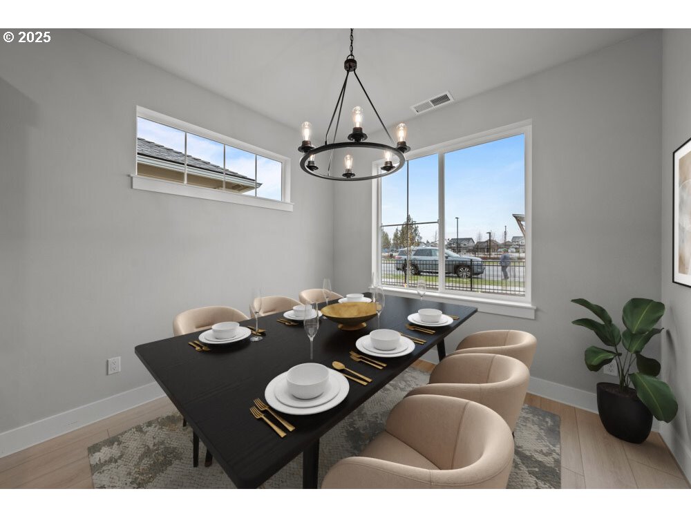 2481 North Villa Road Newberg, OR 97132 - Photo 4 of 11 a dining room with furniture a window and a chandelier