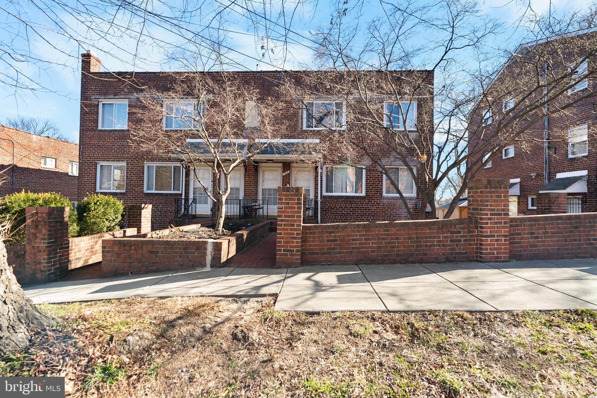 182 Joliet Street Washington, DC 20032 - Photo 2 of 49 a view of a house with a snow in the yard