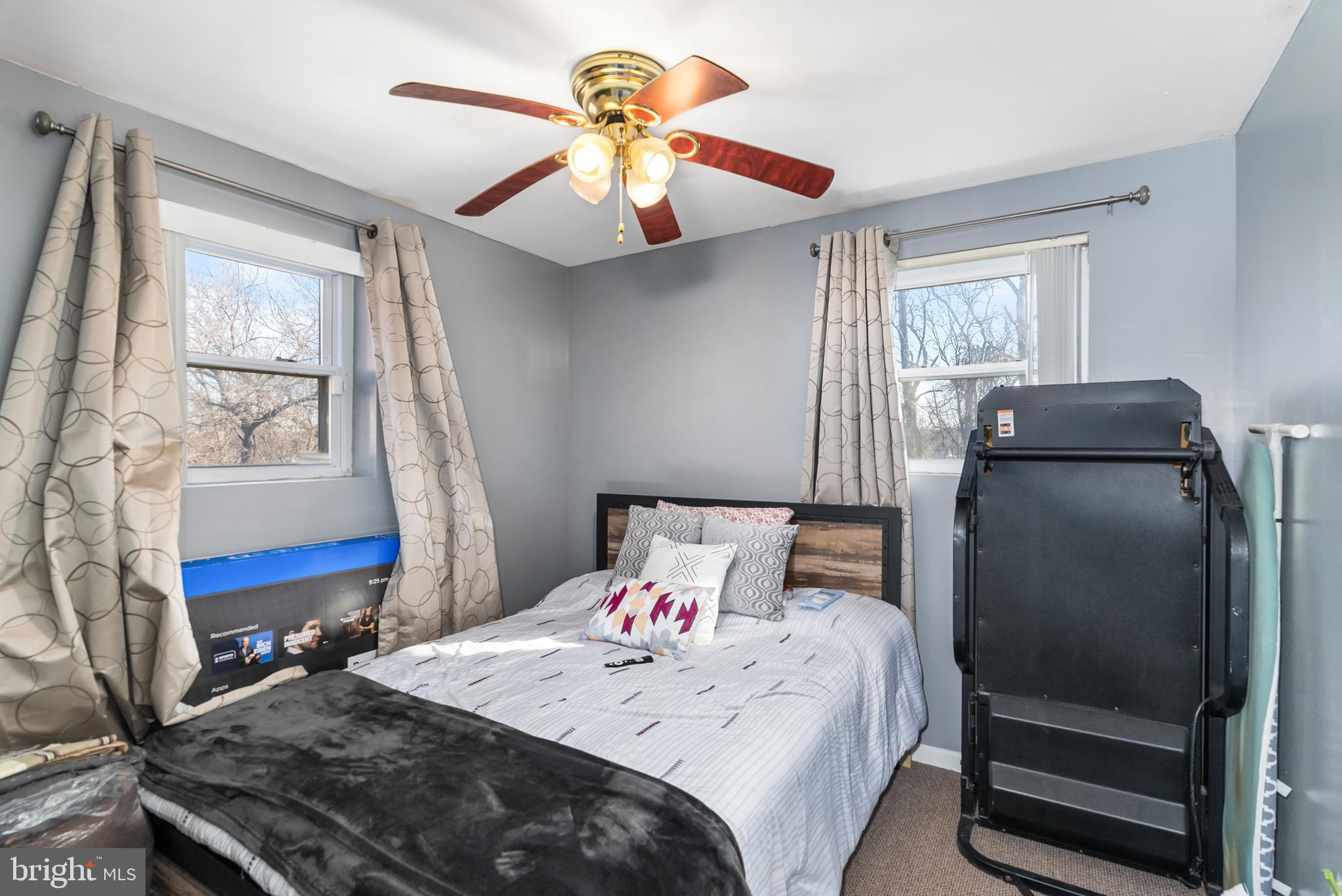 182 Joliet Street Washington, DC 20032 - Photo 29 of 49 a bedroom with a bed and a chandelier