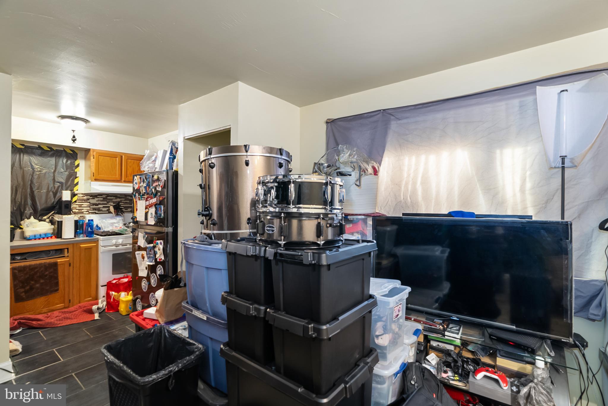 182 Joliet Street Washington, DC 20032 - Photo 38 of 49 a kitchen with lots of clutter and stainless steel appliances