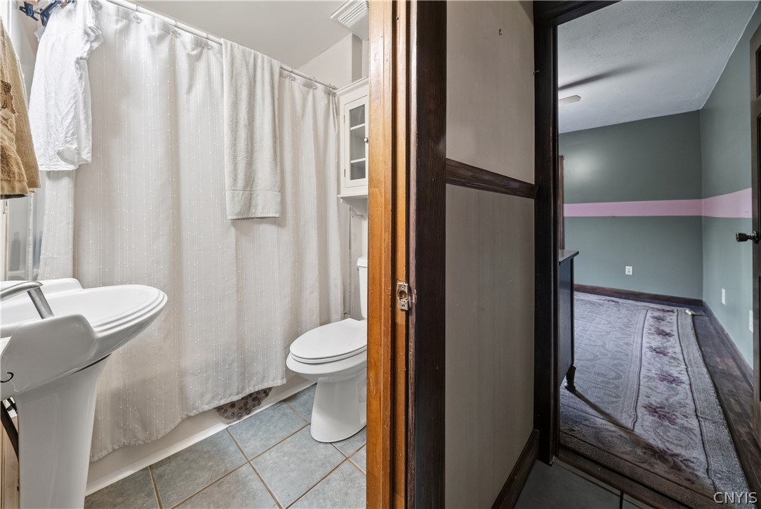 5506 Bear Road Clay, NY 13212 - Photo 17 of 36 On the first level is the full bathroom.