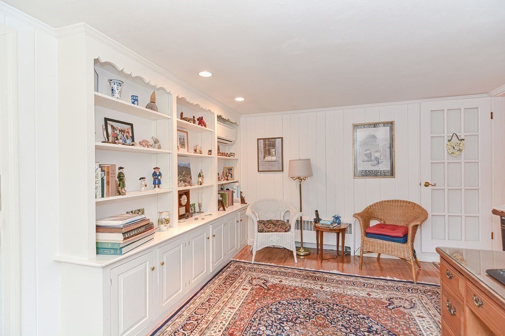 44 Chesterton Road Wellesley, MA 02481 - Photo 13 of 24 a living room with kitchen island furniture and a rug