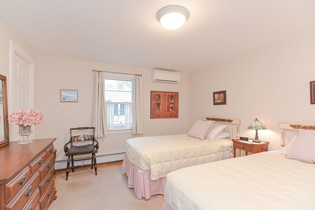 44 Chesterton Road Wellesley, MA 02481 - Photo 15 of 24 a bedroom with two beds and a table