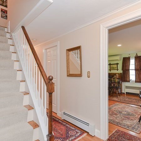 44 Chesterton Road Wellesley, MA 02481 - Photo 17 of 24 a view of a livingroom with wooden floor and stairs