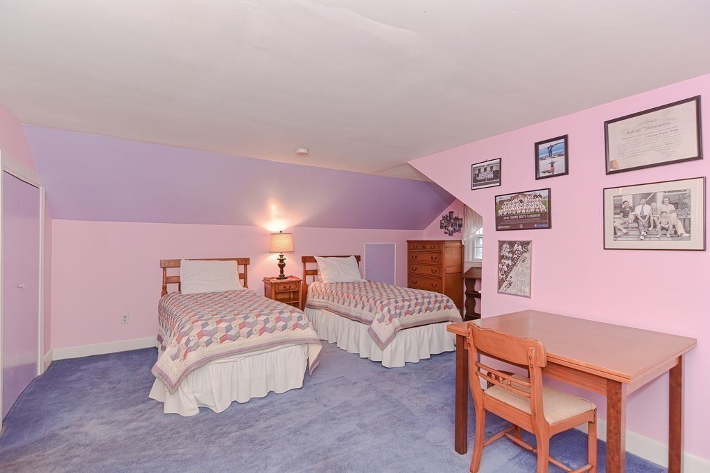 44 Chesterton Road Wellesley, MA 02481 - Photo 19 of 24 a spacious bedroom with two beds and painting on the wall
