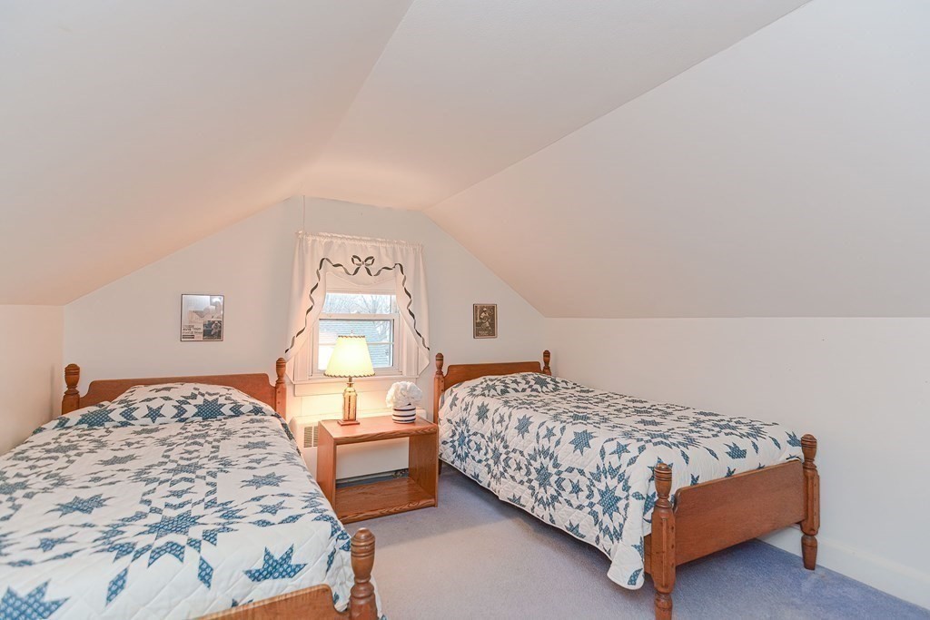 44 Chesterton Road Wellesley, MA 02481 - Photo 20 of 24 a bedroom with a bed and window