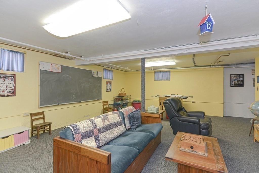 44 Chesterton Road Wellesley, MA 02481 - Photo 22 of 24 a living room with furniture and a flat screen tv