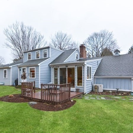 44 Chesterton Road Wellesley, MA 02481 - Photo 4 of 24 a front view of a house with a garden and yard