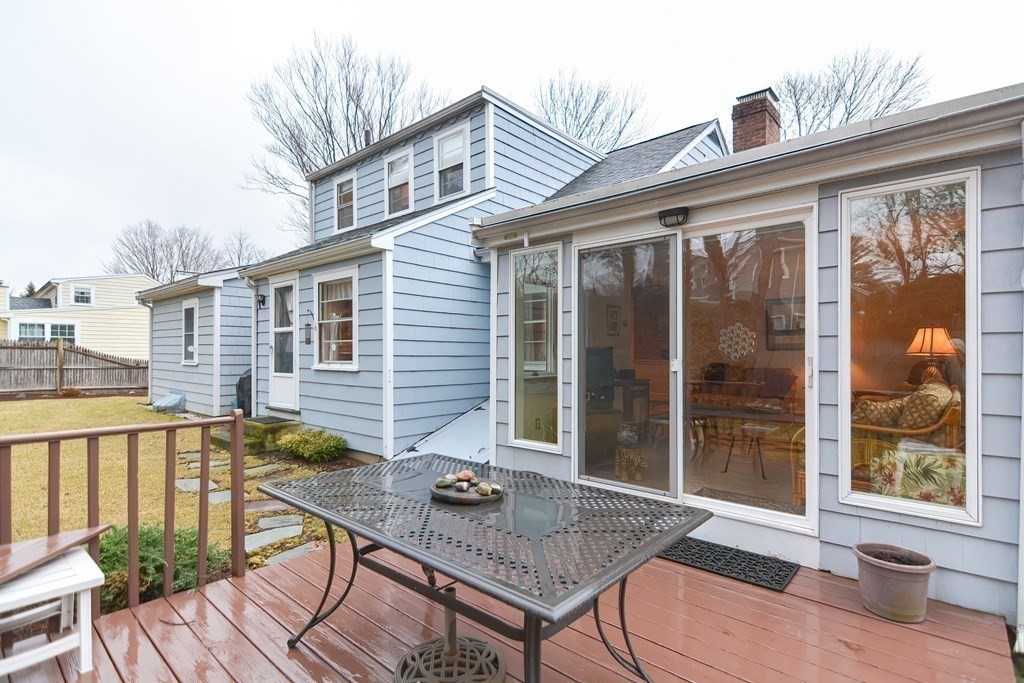 44 Chesterton Road Wellesley, MA 02481 - Photo 5 of 24 a view of a house with a patio