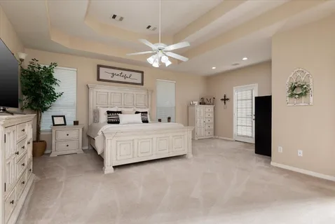 a bed room with furniture and a chandelier