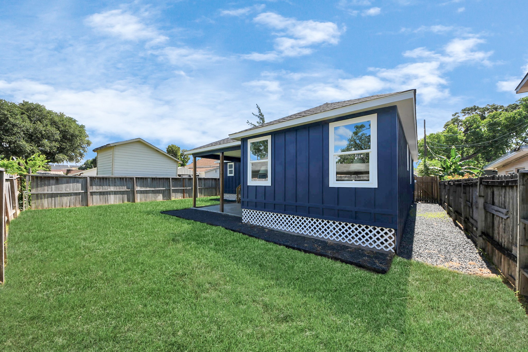 1737 Tabor Street Houston, TX 77009 - Photo 9 of 46 a view of a house with a backyard and a garden