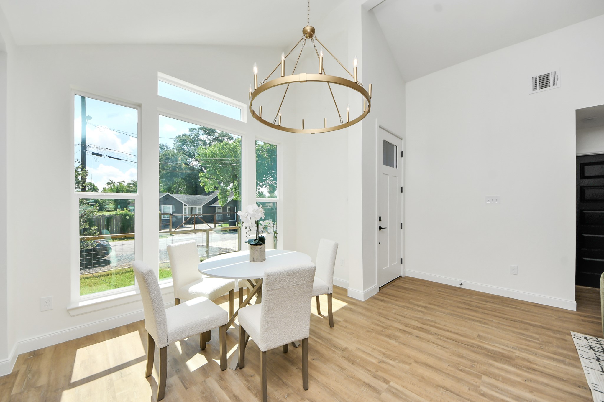 1737 Tabor Street Houston, TX 77009 - Photo 10 of 46 a view of a dining room with furniture window and wooden floor