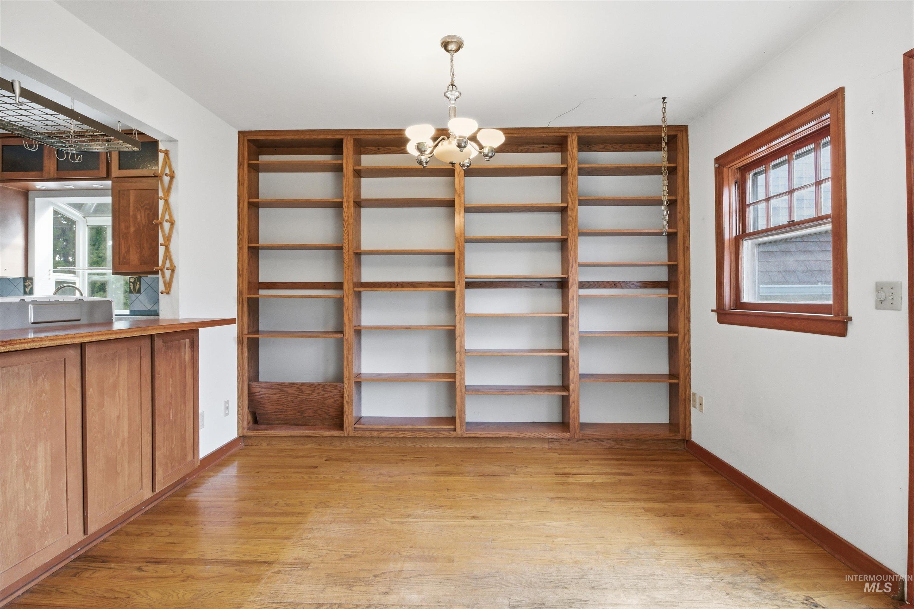 1117 East 6th Street Moscow, ID 83843 - Photo 12 of 46 Unfurnished dining area with hanging lights and light wood-style floors