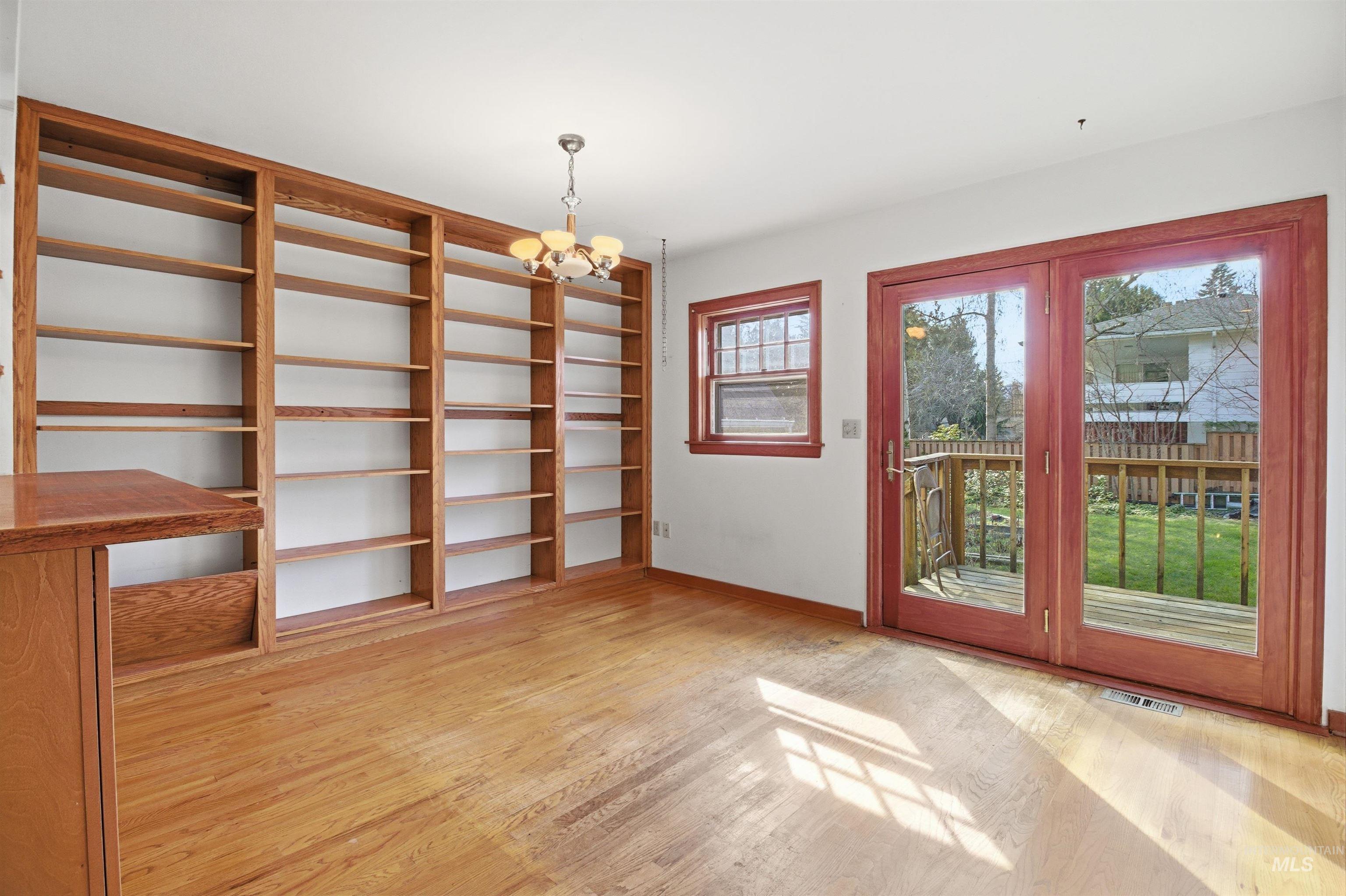 1117 East 6th Street Moscow, ID 83843 - Photo 13 of 46 Entryway with hanging lights and wood finished floors