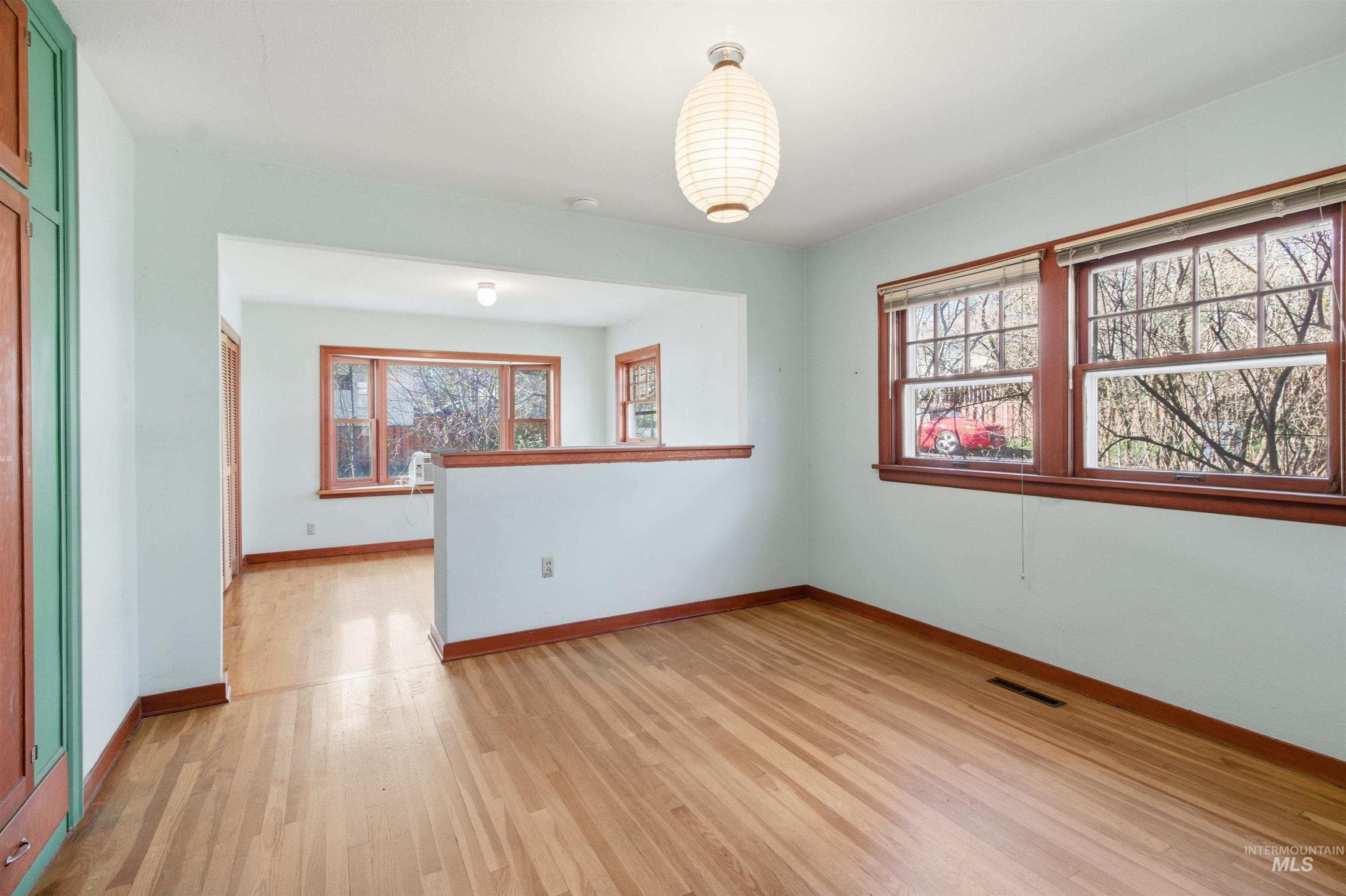 1117 East 6th Street Moscow, ID 83843 - Photo 28 of 46 Empty room with light wood-style floors and baseboards