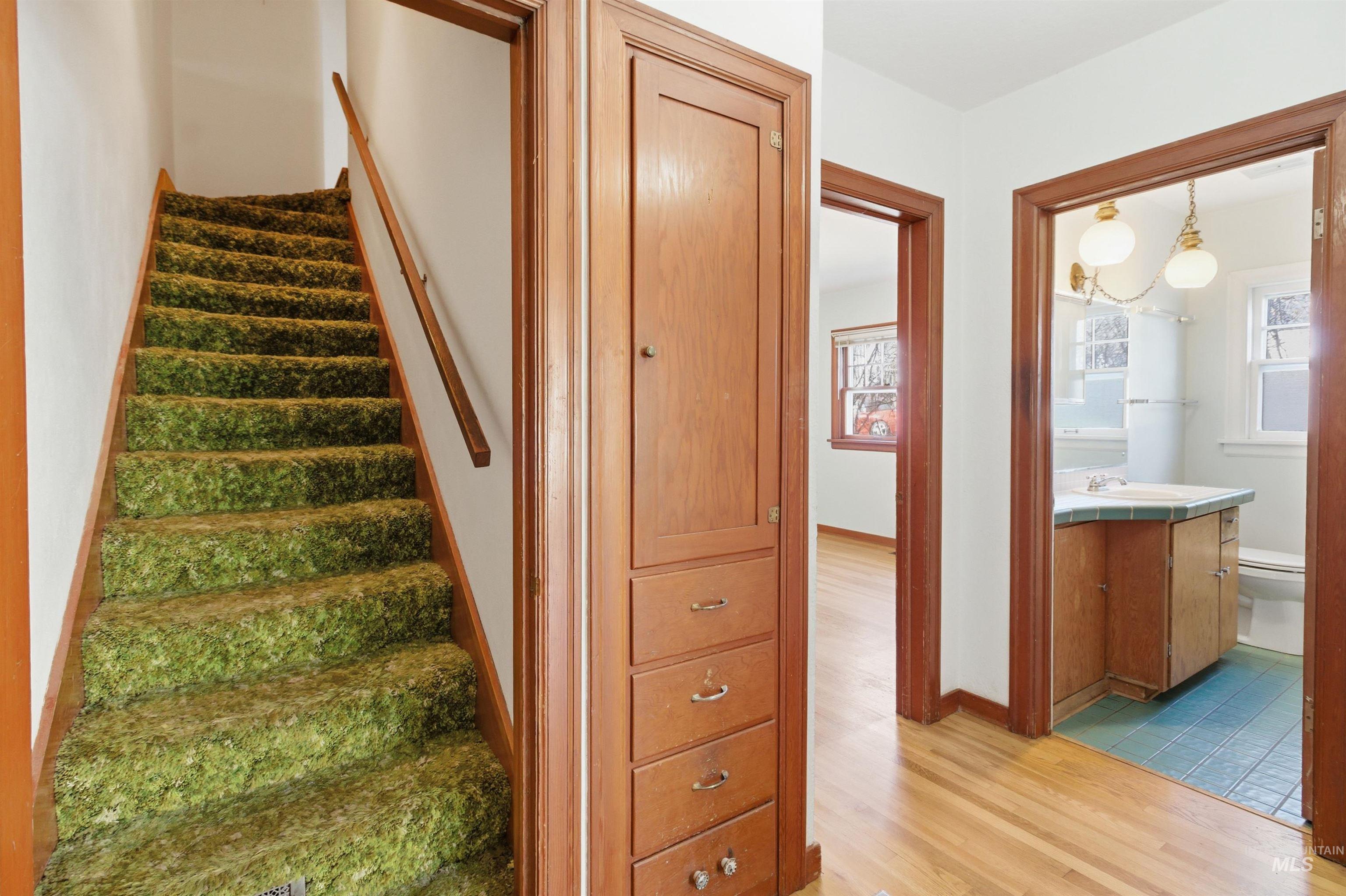 1117 East 6th Street Moscow, ID 83843 - Photo 32 of 46 Staircase featuring wood finished floors and baseboards