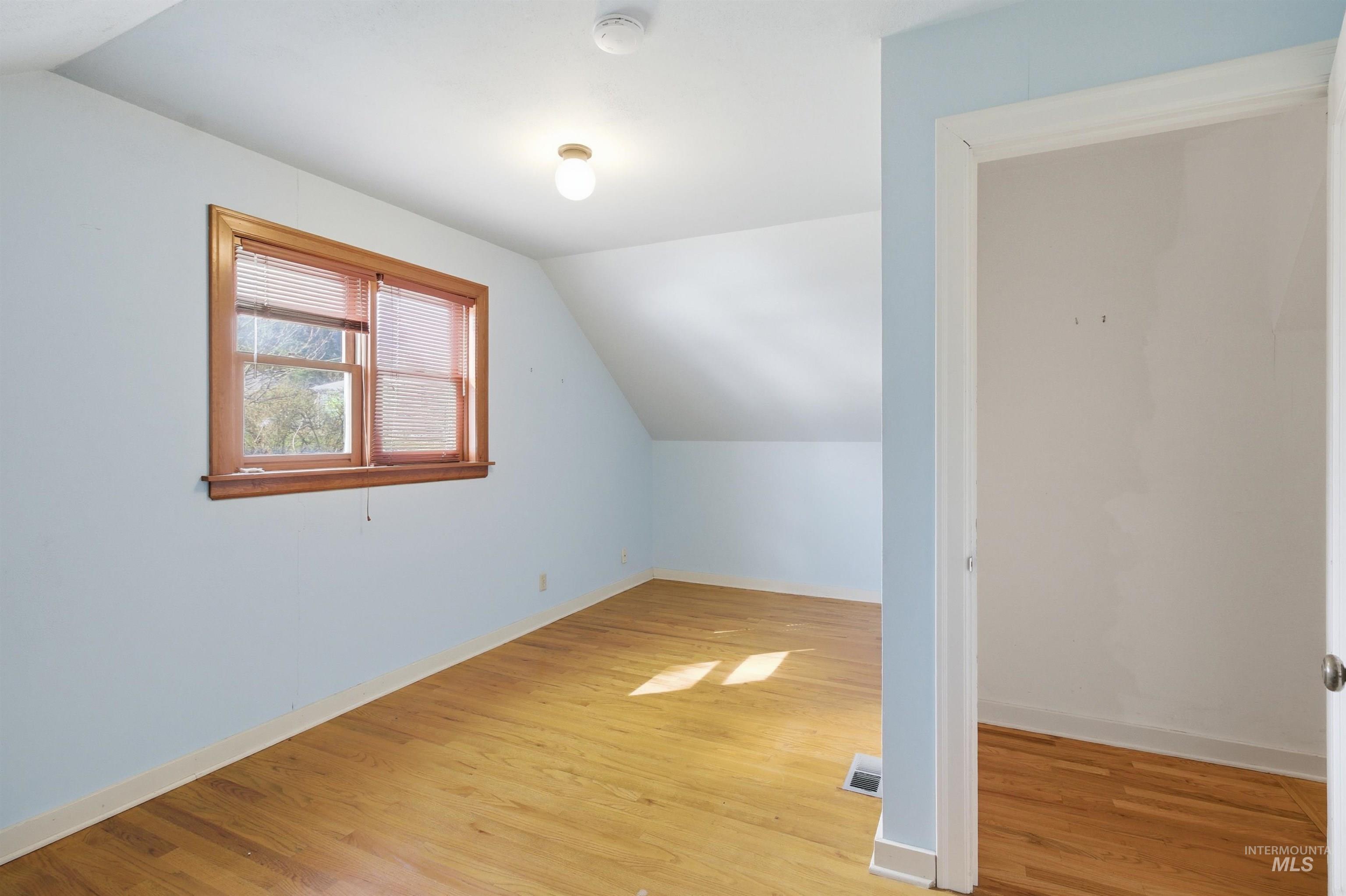 1117 East 6th Street Moscow, ID 83843 - Photo 33 of 46 Bonus room with vaulted ceiling and light wood finished floors