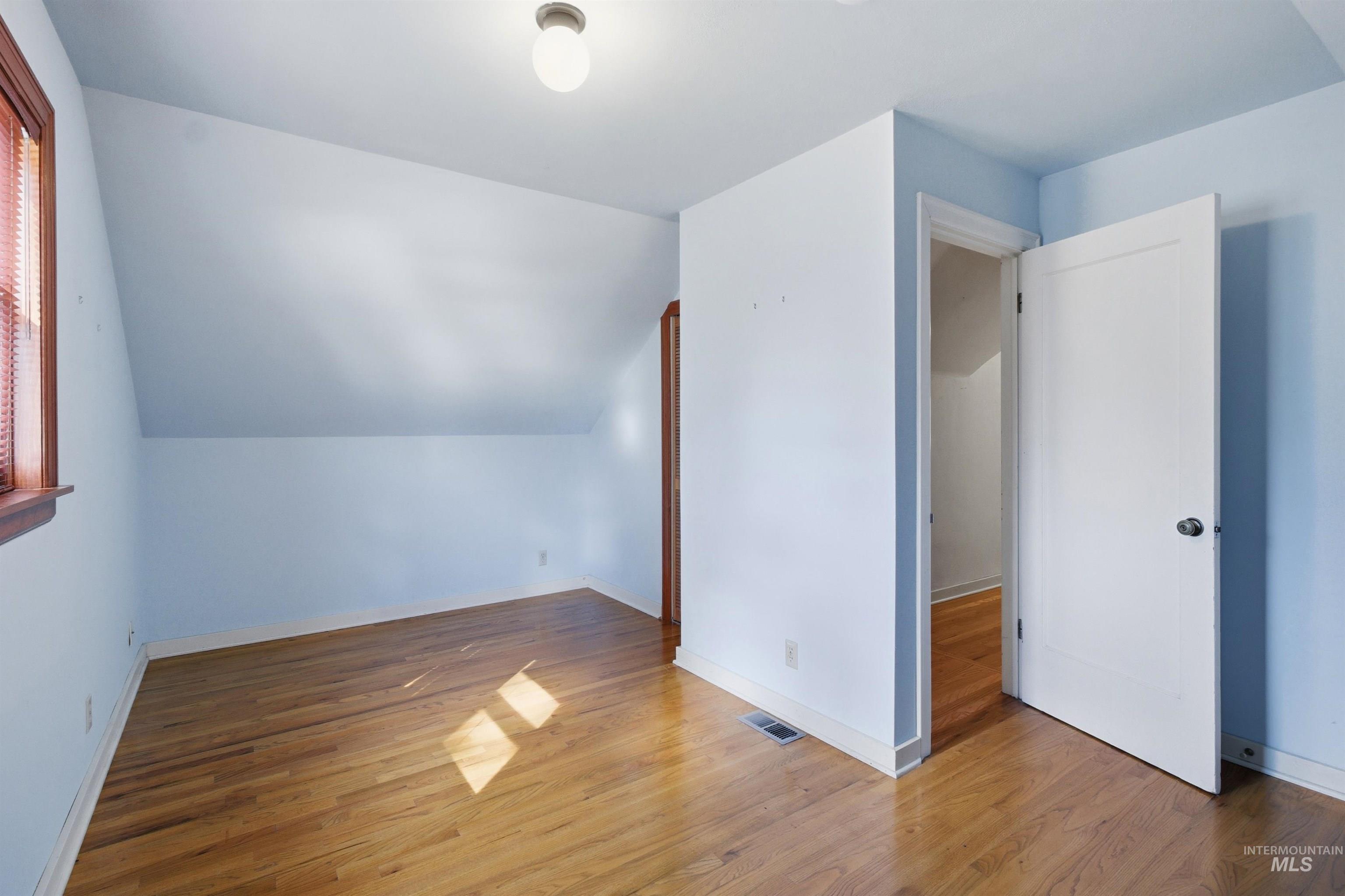 1117 East 6th Street Moscow, ID 83843 - Photo 34 of 46 Additional living space with vaulted ceiling and light wood-type flooring