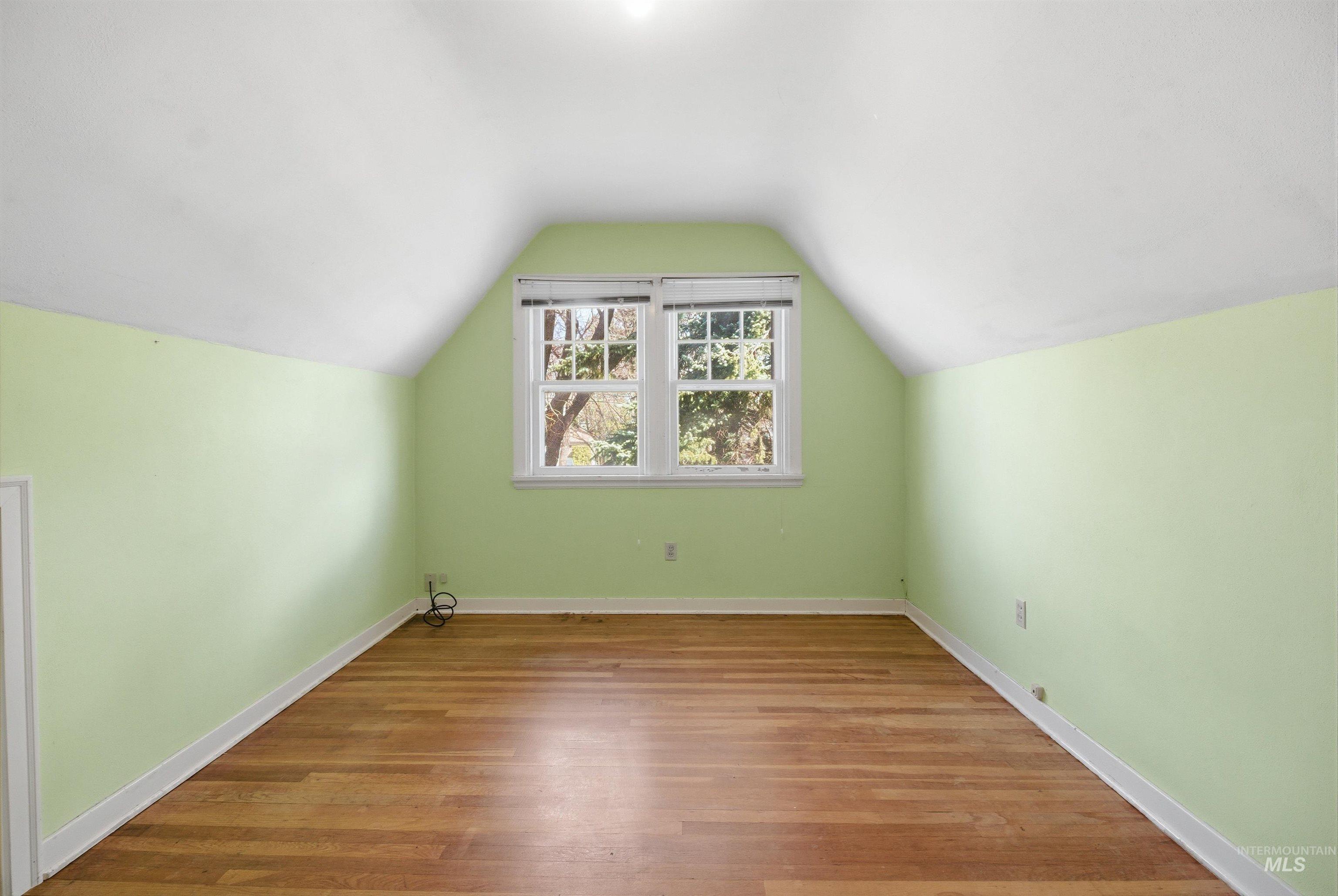 1117 East 6th Street Moscow, ID 83843 - Photo 39 of 46 Additional living space featuring baseboards and wood finished floors