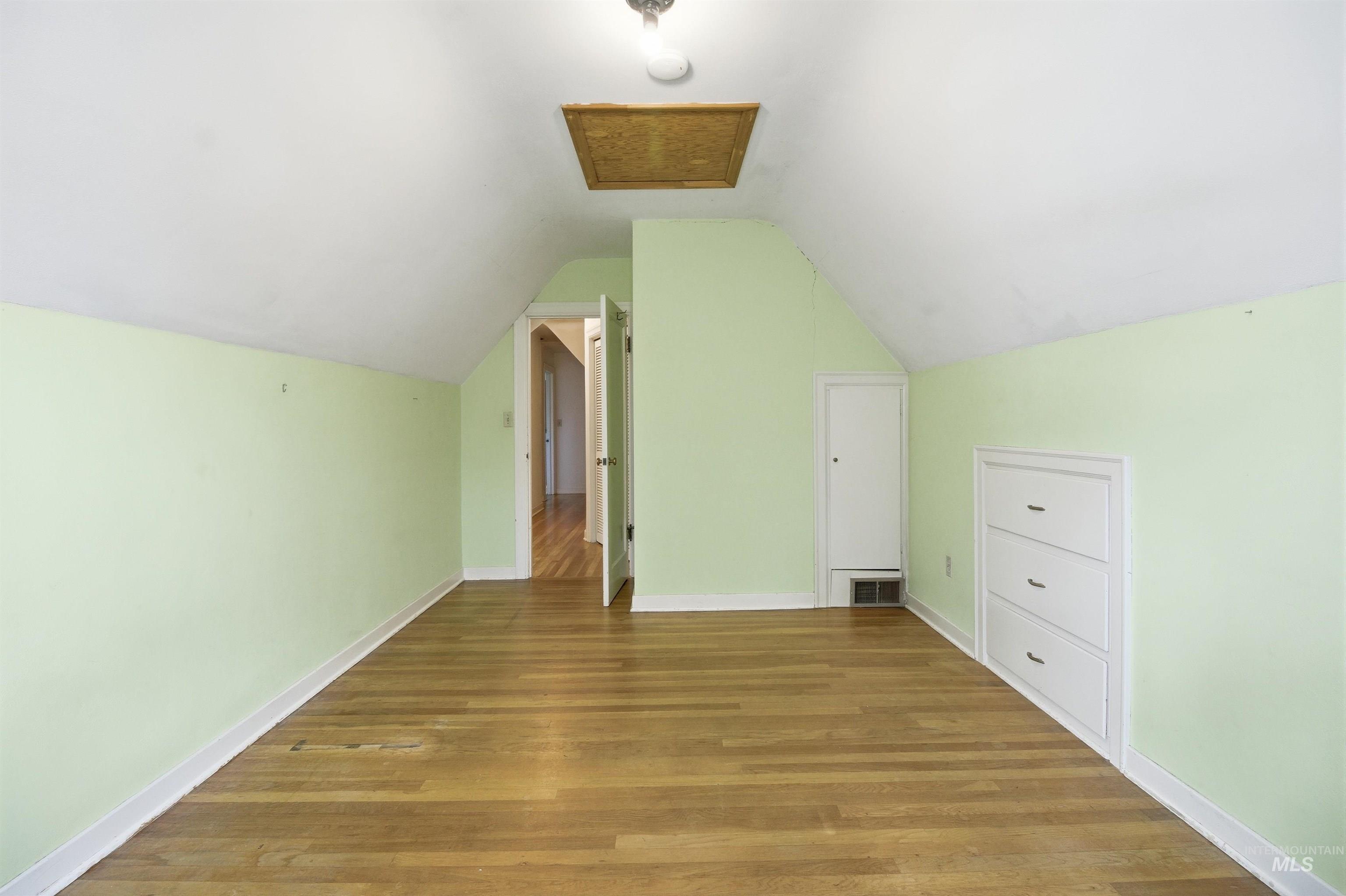 1117 East 6th Street Moscow, ID 83843 - Photo 40 of 46 Additional living space with wood finished floors and lofted ceiling