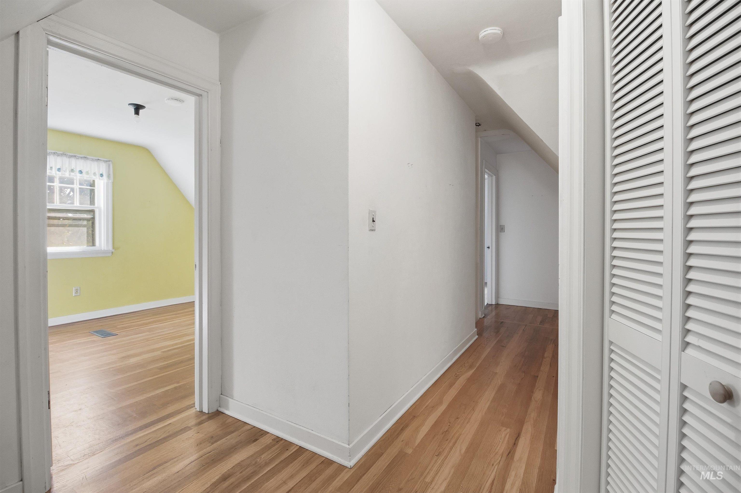 1117 East 6th Street Moscow, ID 83843 - Photo 41 of 46 Hallway featuring light wood-type flooring and baseboards