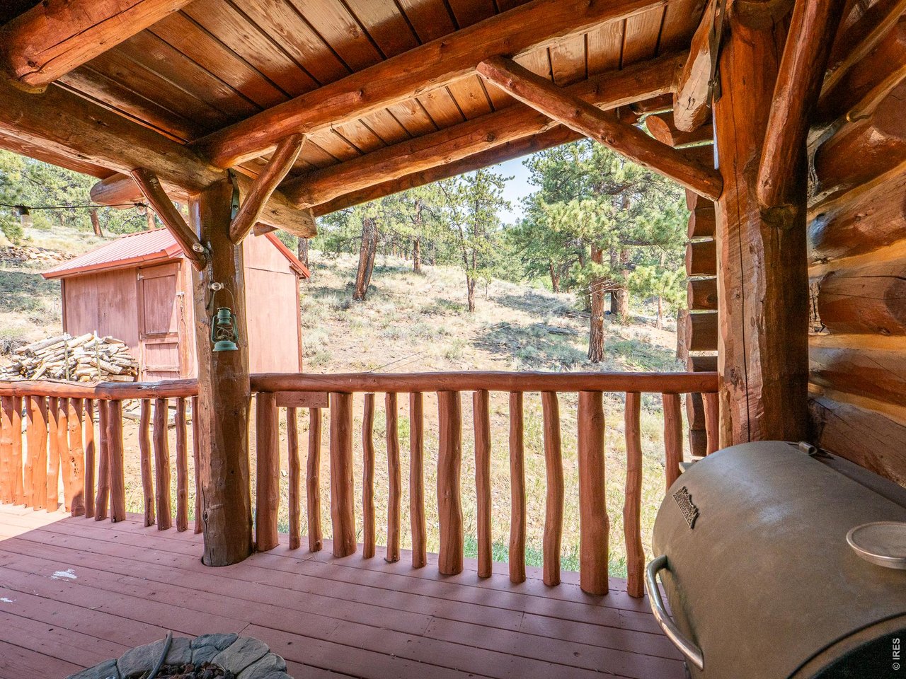 296 Caddo Road Red Feather Lakes, CO 80545 - Photo 4 of 50 Spacious covered front deck.