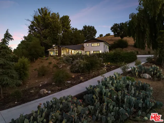 a bedroom with bed and window
