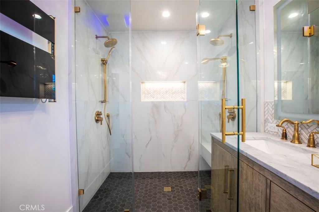 32052 Via Alicia San Juan Capistrano, CA 92675 - Photo 22 of 39 a bathroom with a shower and a sink