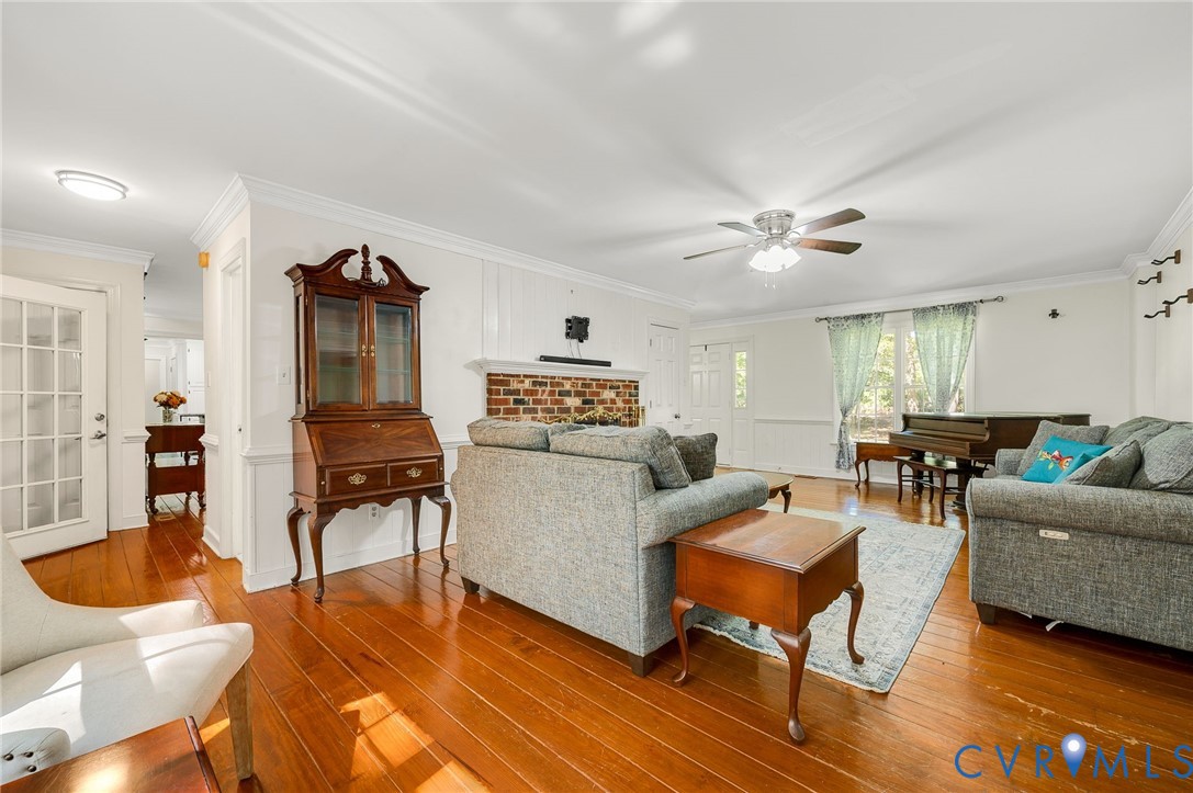 2409 Three Bridge Road Powhatan, VA 23139 - Photo 16 of 39 Hardwood flooring throughout, brick fireplace with