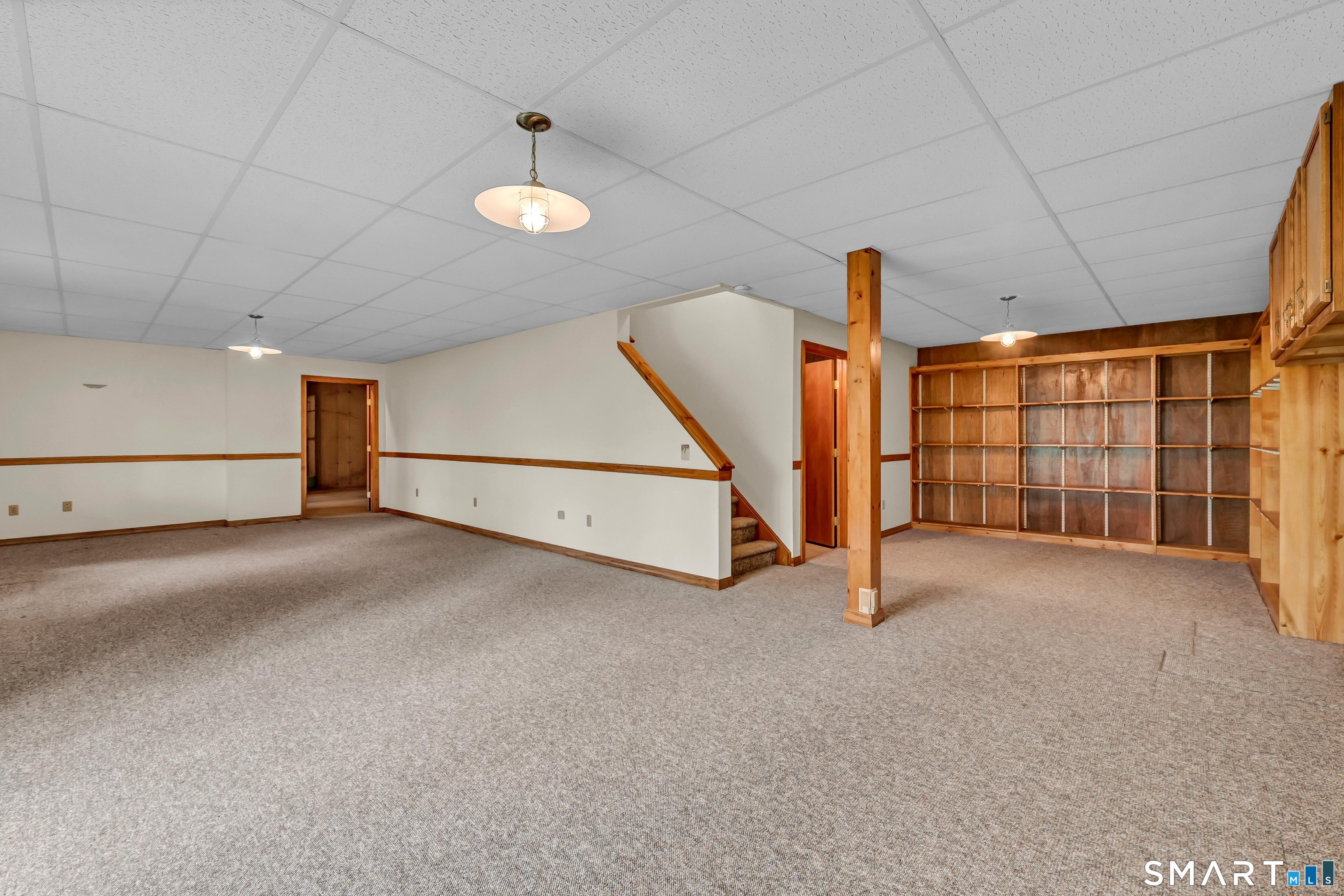 201 Grey Rock Road Southbury, CT 06488 - Photo 32 of 40 Finished walk-out Lower Level Rec Room with Shelving