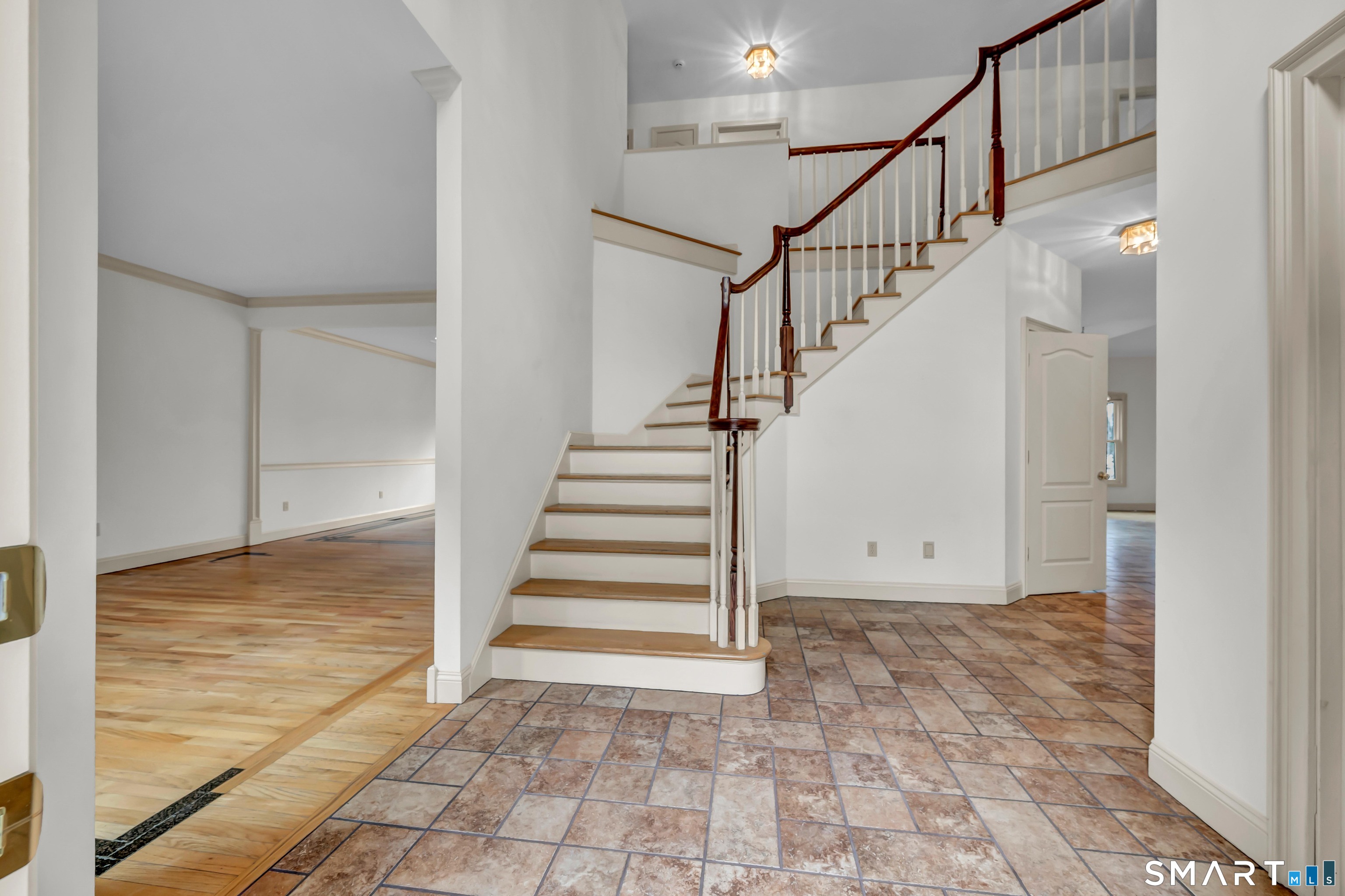 201 Grey Rock Road Southbury, CT 06488 - Photo 7 of 40 Elegant staircase in 2-story foyer with tile