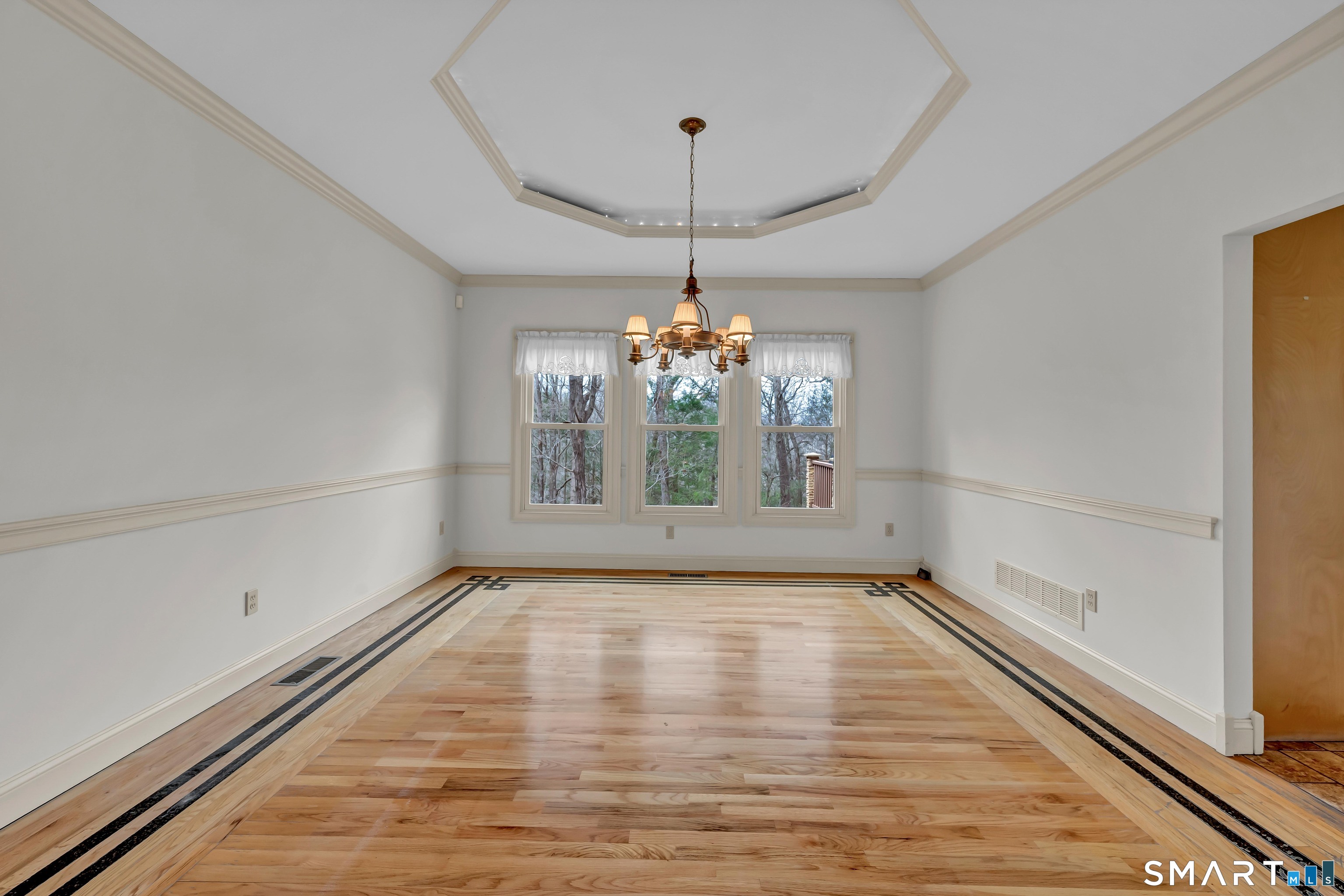 201 Grey Rock Road Southbury, CT 06488 - Photo 8 of 40 Beautiful dining room with tray ceiling and wood inlay flooring