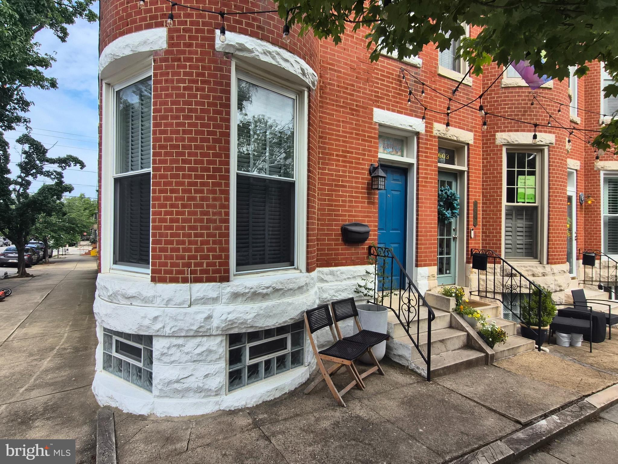 1601 Belt Street Baltimore, MD 21230 - Photo 2 of 30 front view of house with a chairs and table in the patio