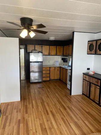 a kitchen with stainless steel appliances granite countertop a stove and a refrigerator
