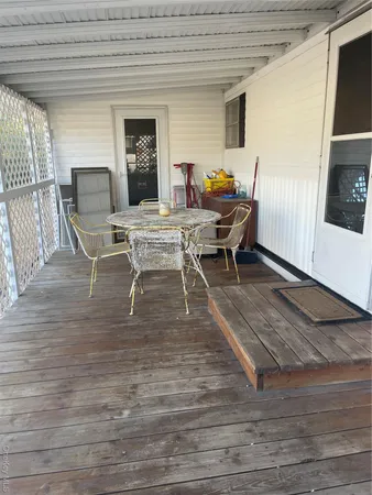 a outdoor space with a couch and chairs