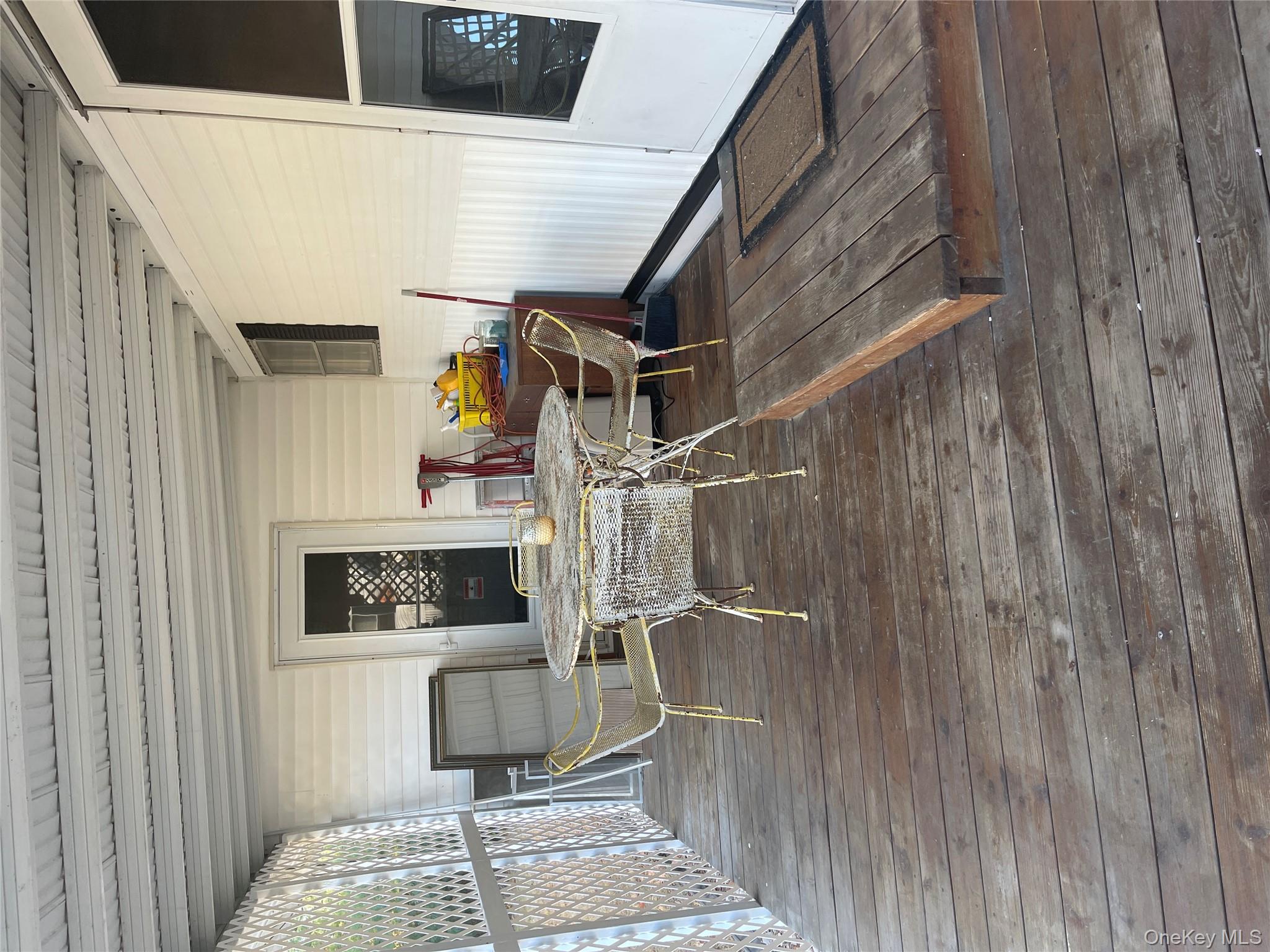 1661 Old Country Road, Unit 308 Riverhead, NY 11901 - Photo 3 of 10 a outdoor space with a couch and chairs