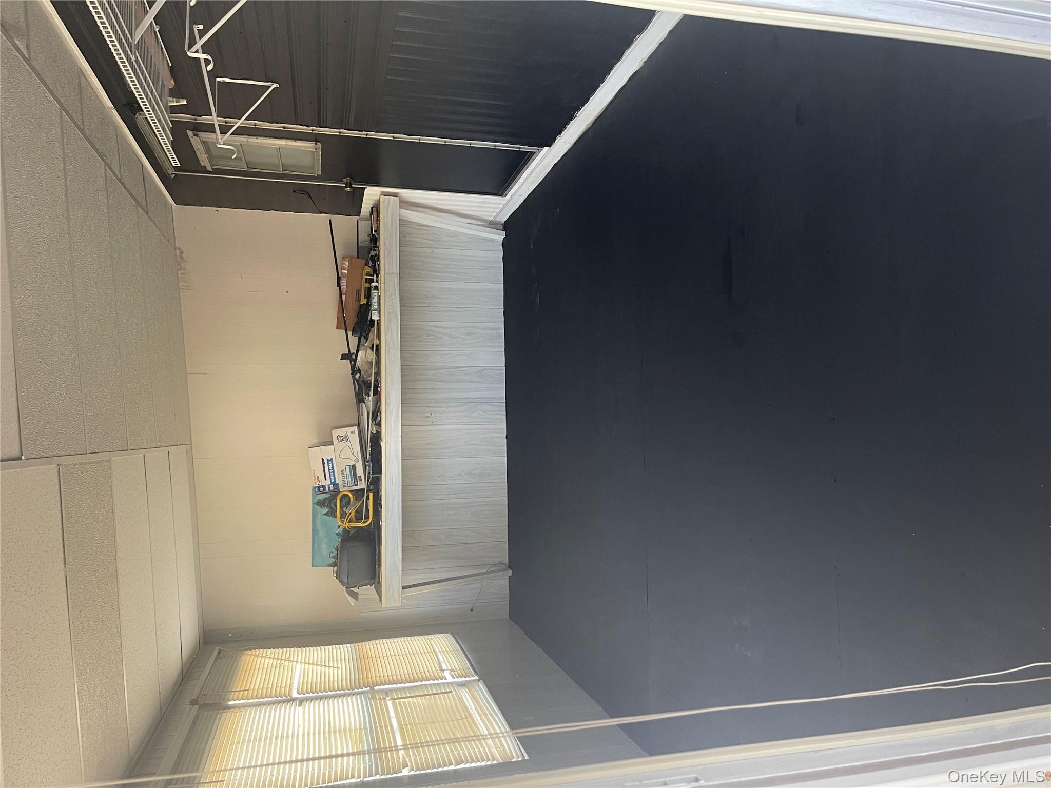 1661 Old Country Road, Unit 308 Riverhead, NY 11901 - Photo 6 of 10 a kitchen with a sink a window and cabinets