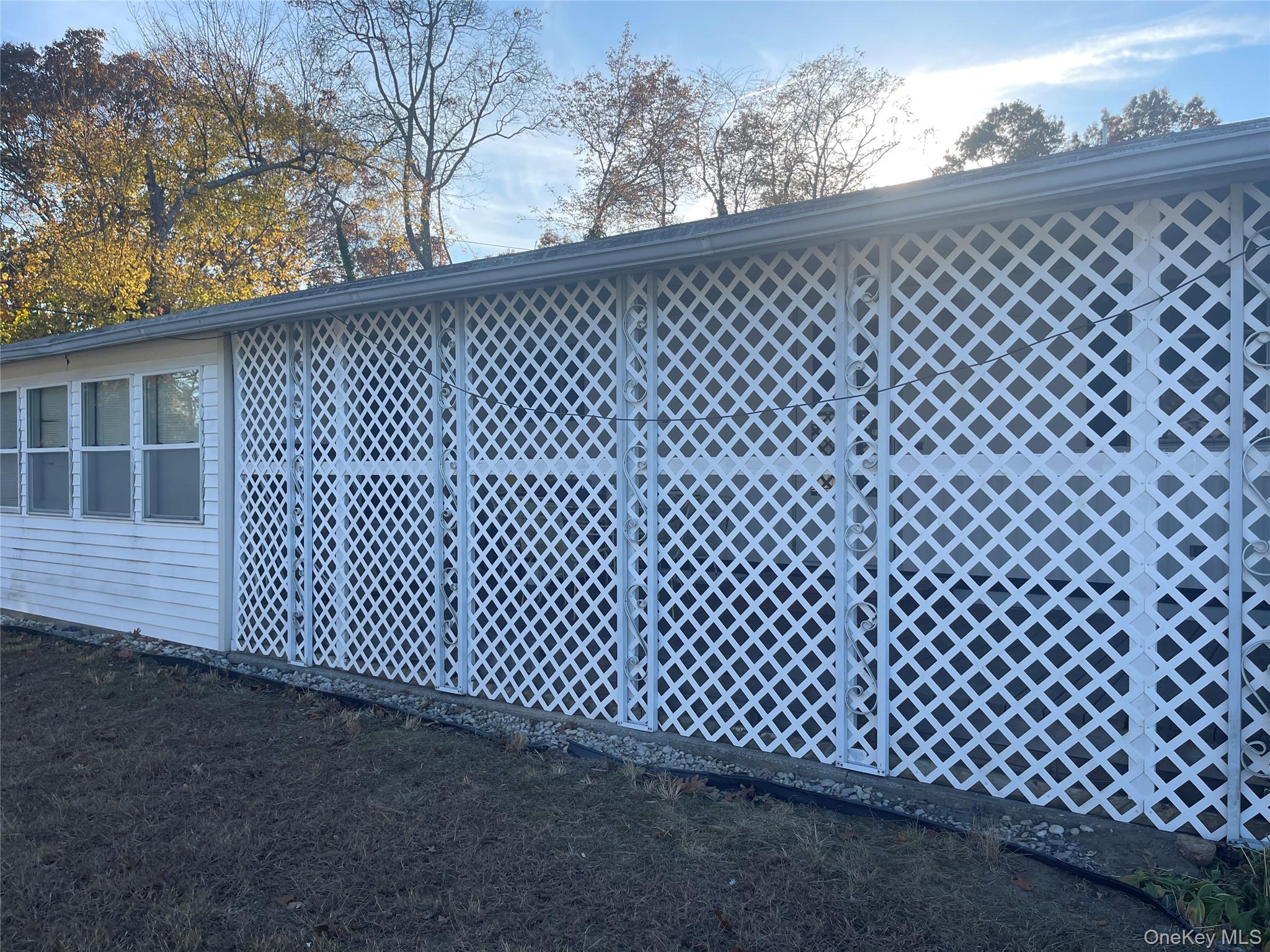 1661 Old Country Road, Unit 308 Riverhead, NY 11901 - Photo 7 of 10 a view of a black gate
