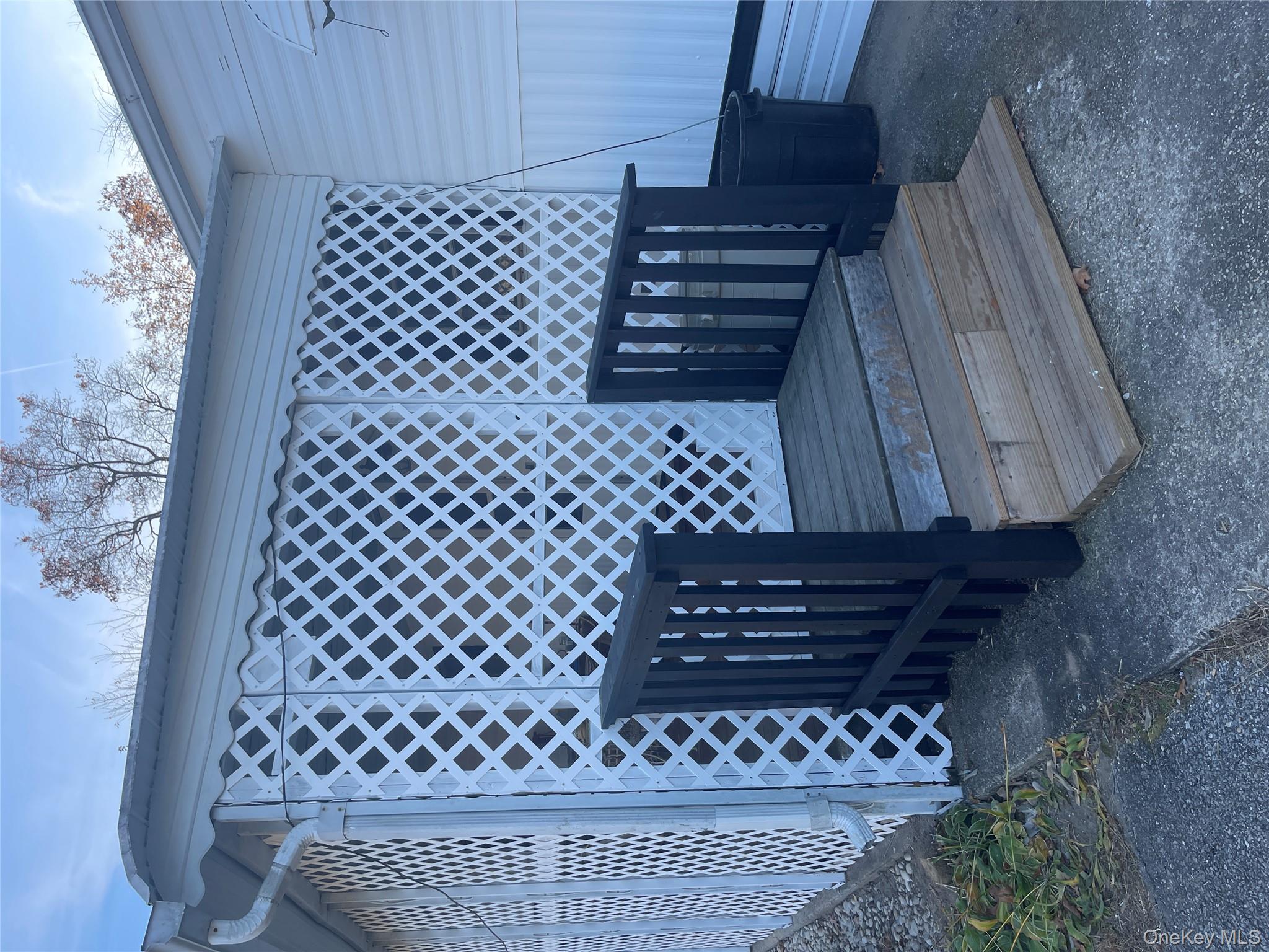 1661 Old Country Road, Unit 308 Riverhead, NY 11901 - Photo 8 of 10 a view of a backyard