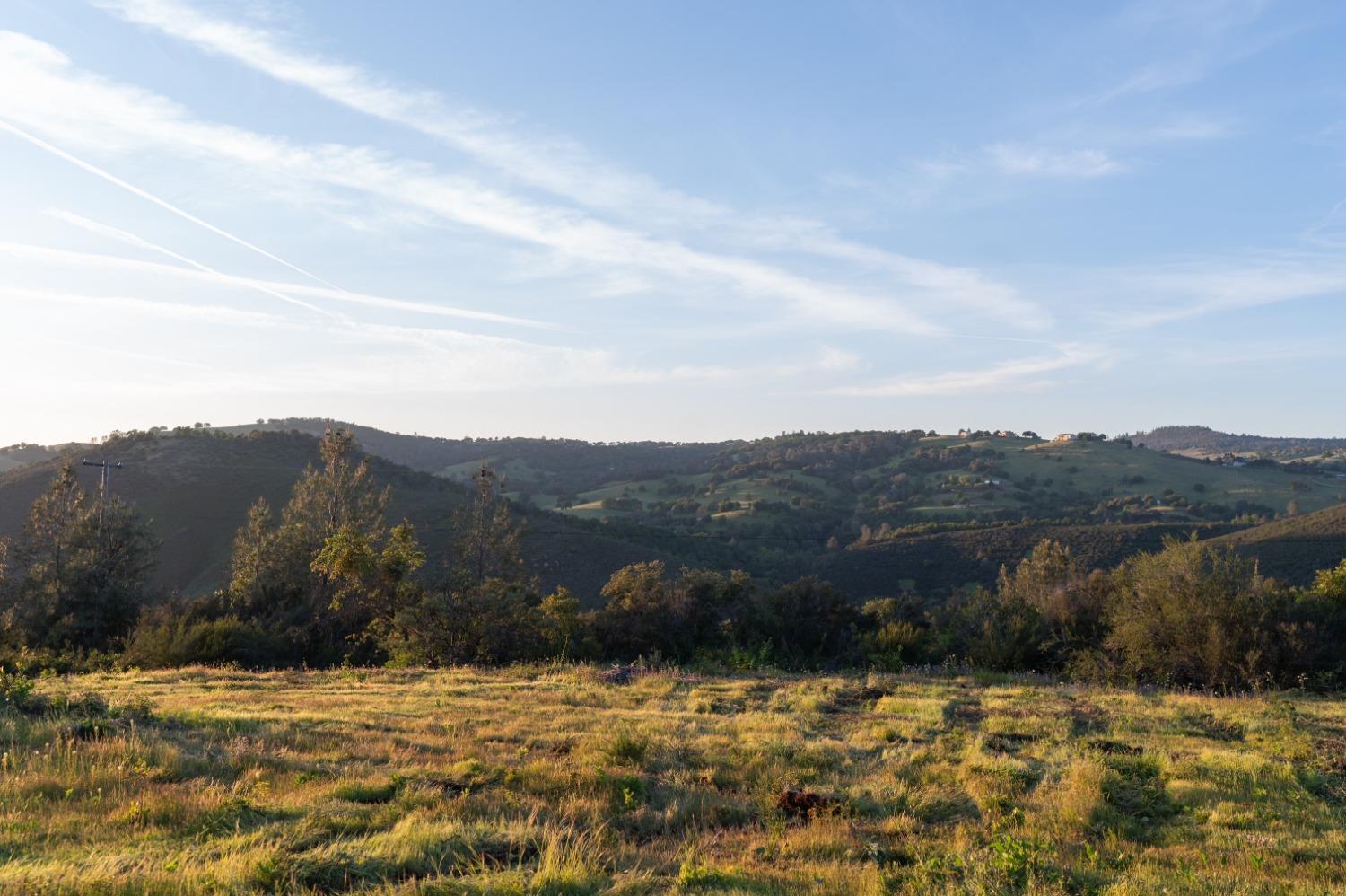 1940 Dorado Ridge Trail Rescue, CA 95672 - Photo 22 of 24 a view of a lake with mountains in the background
