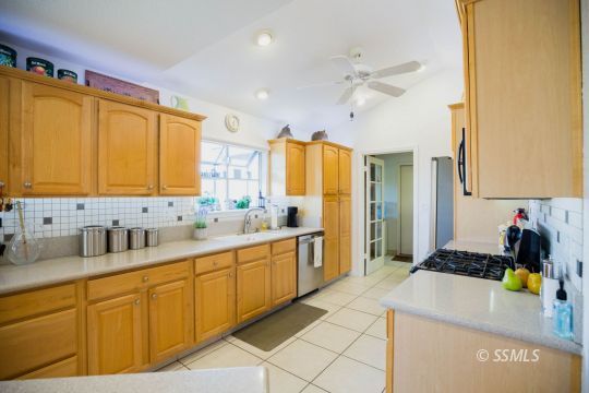 500 Scott Street Ridgecrest, CA 93555 - Photo 13 of 37 a kitchen with a sink appliances and cabinets